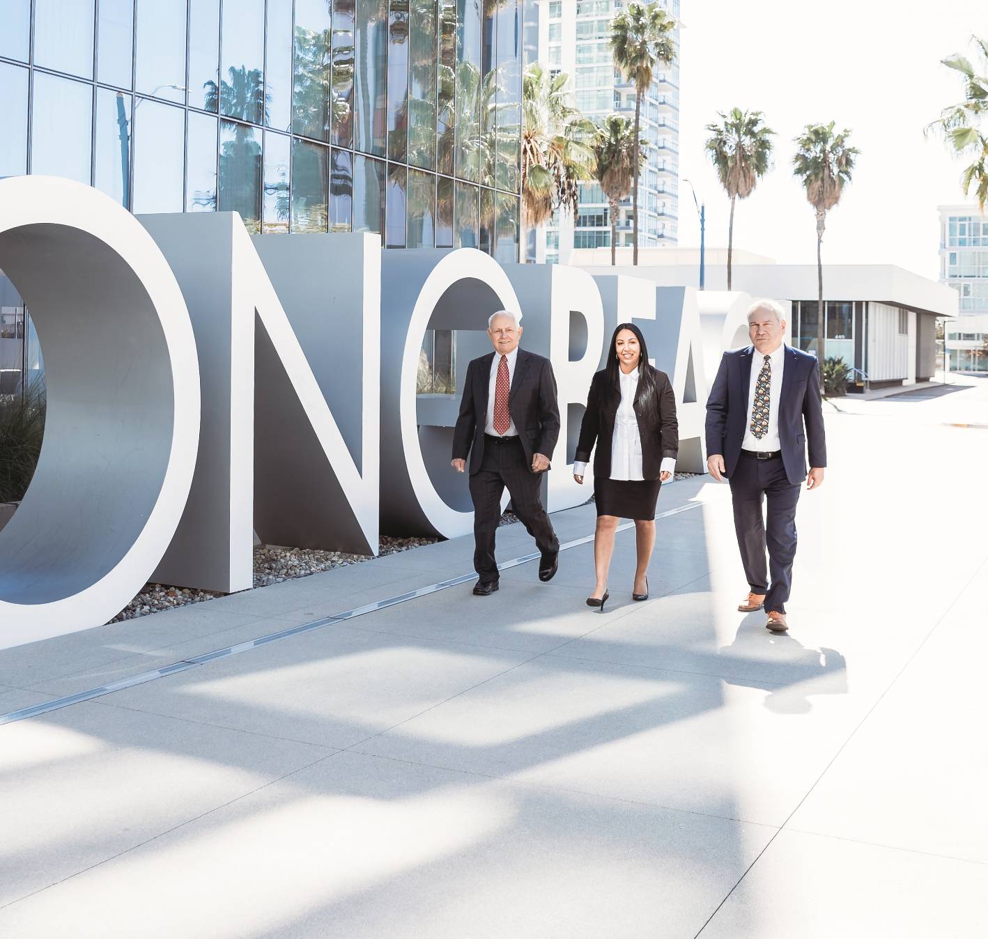 Sheva, George, and Steve walking in Long Beach